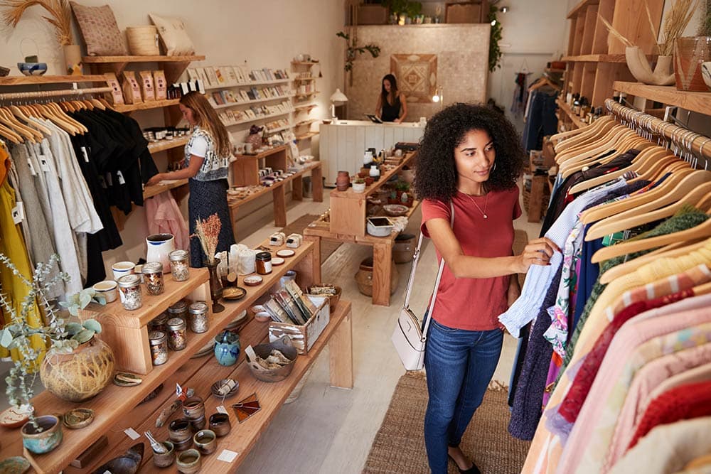 A customer browsing the rails in a boutique